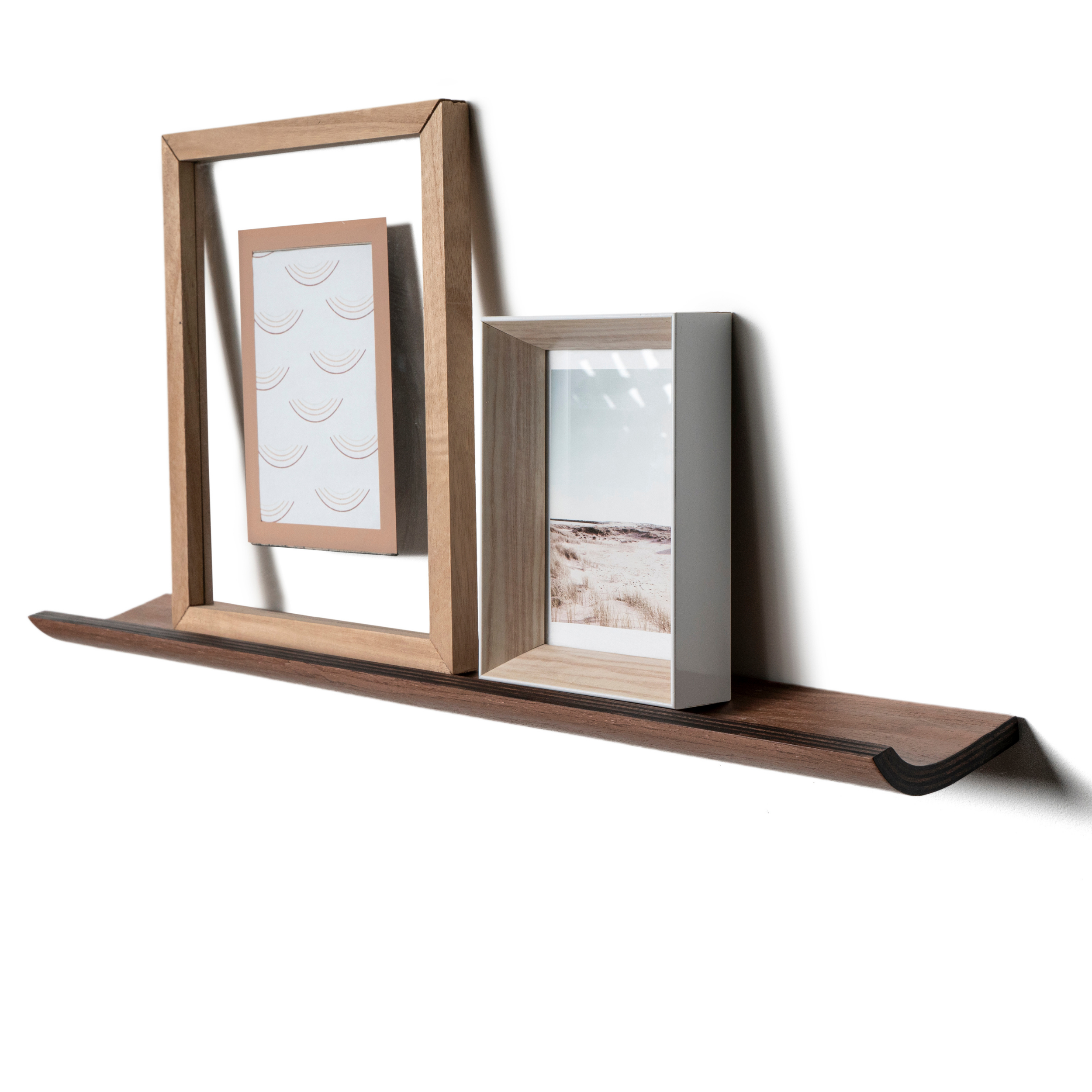 Modern picture ledge shelf design for displaying photo frames and wall art